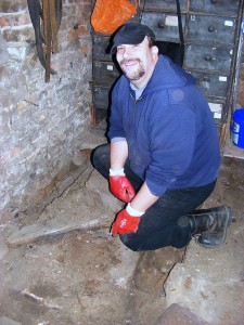 Richard Buck excavating in the small store - 25 November 2011