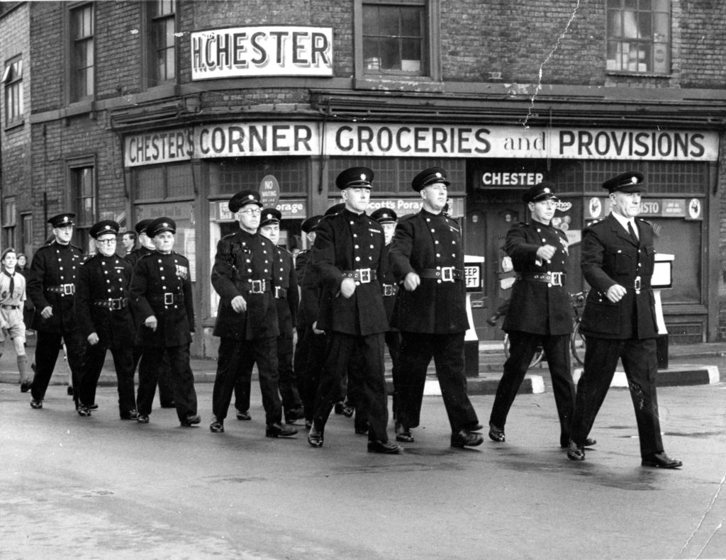 remembrance-day-parade-with-fireman-marching-through-town-1957-keith-seaton-is-scout